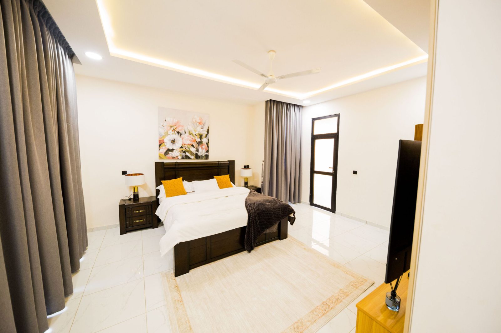 Master bedroom with warm cove lighting