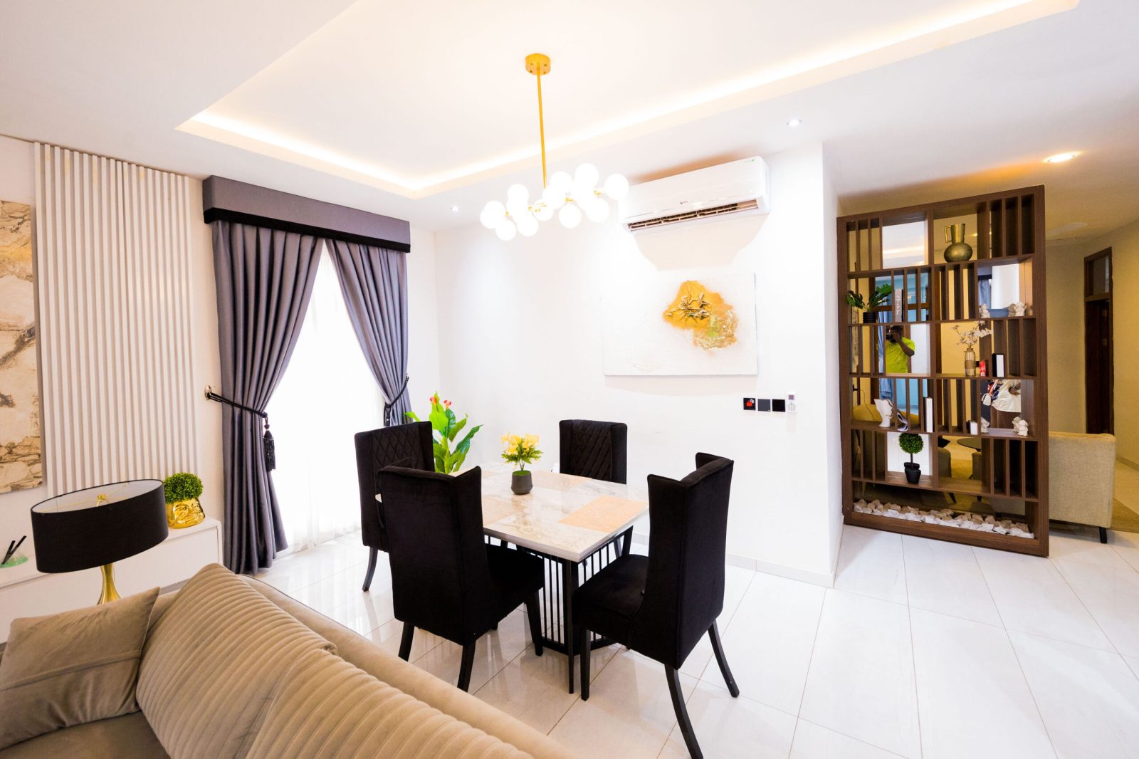 Bright dining area with marble table and pendant lighting