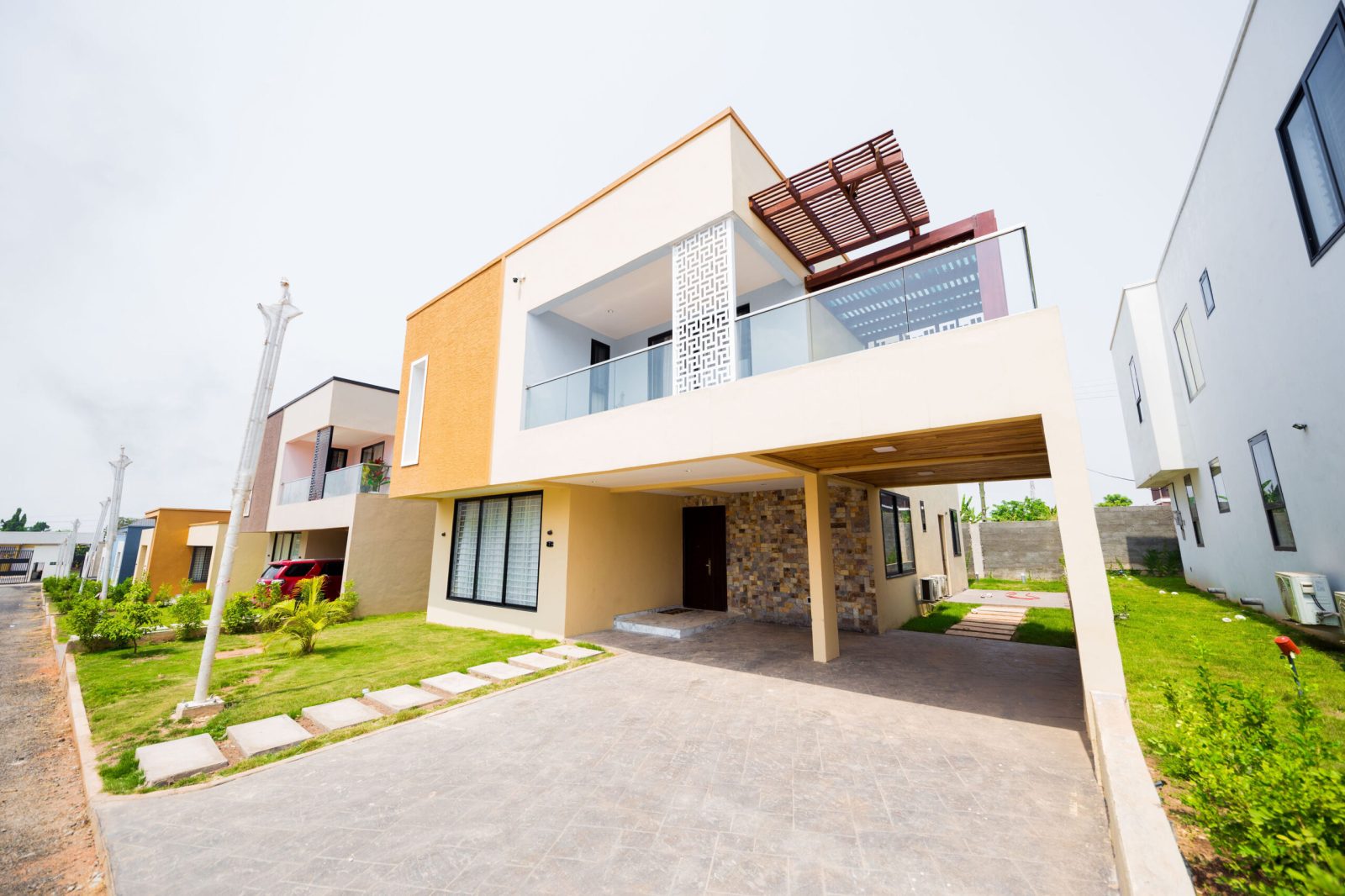 Anchora home exterior with stone-clad entrance and carport