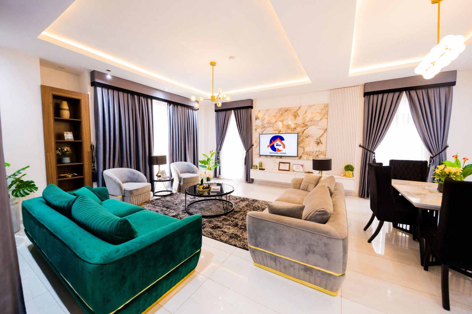 Luxury living room with emerald velvet sofa and marble feature wall