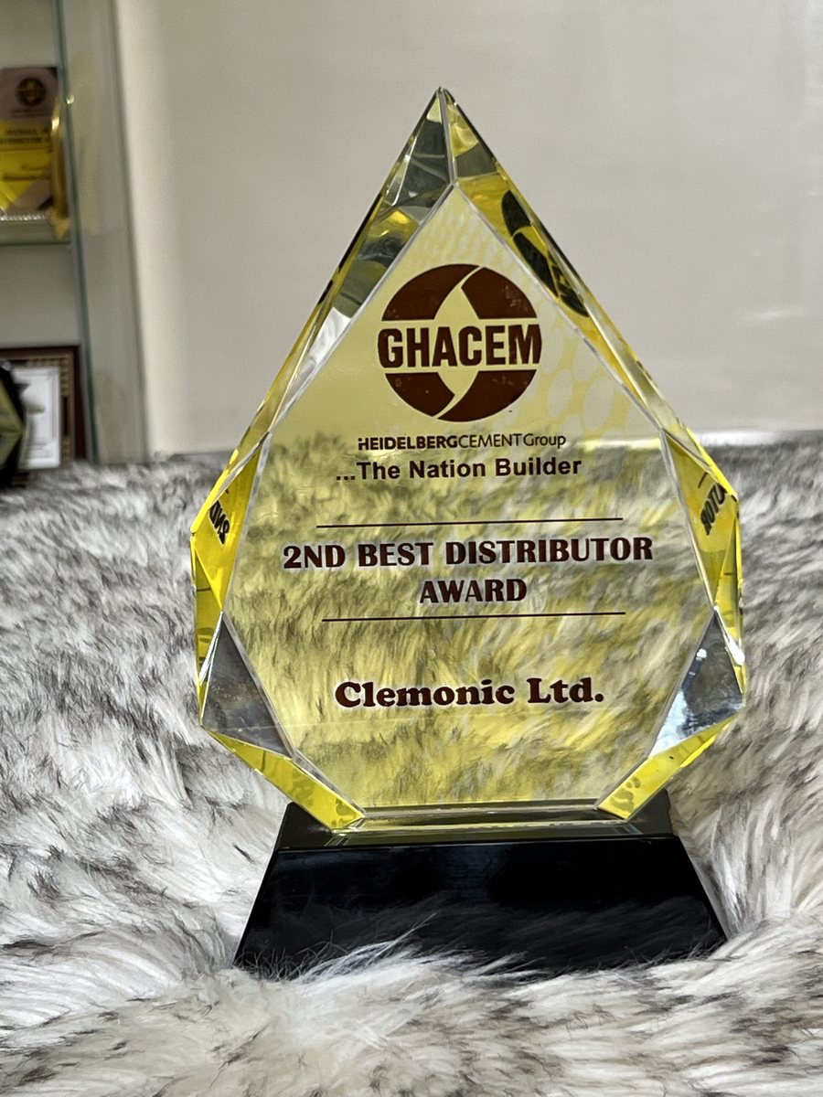 Faceted yellow crystal on a black base: GHACEM 2nd Best Distributor Award, presented to Clemonic Ltd.
