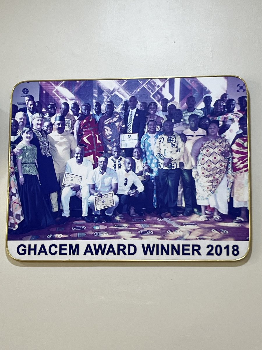 Photo board captioned GHACEM AWARD WINNER 2018: a large group photo at Ghacem's awards night, several people holding award certificates